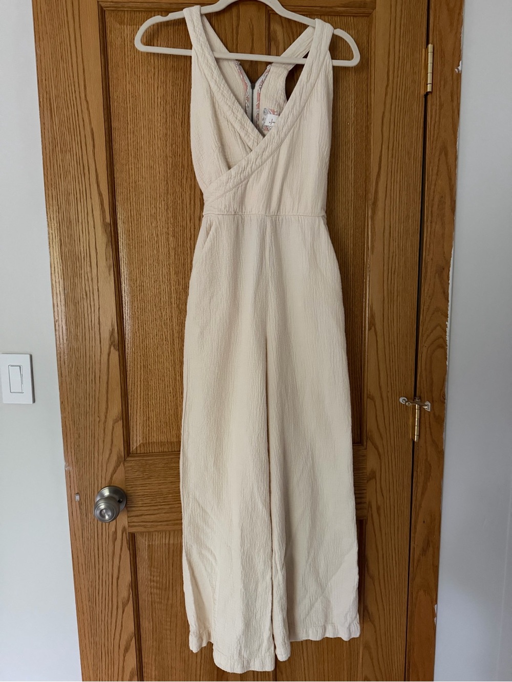 Sleeveless Cream Wide-Leg Cross-Back Jumpsuit